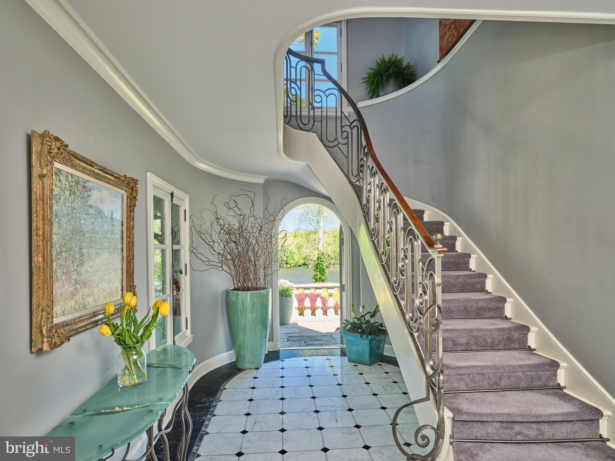 3052 River Road New Hope, PA 18938 - Photo 13 of 49 a view of staircase with wooden floor and a chandelier