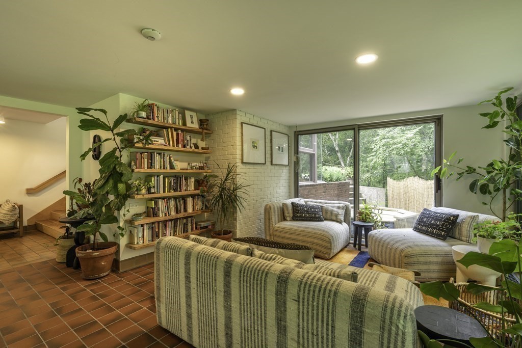 640 Kennedy Road Northampton, MA 01053 - Photo 14 of 42 a living room with furniture a chandelier and a floor to ceiling window