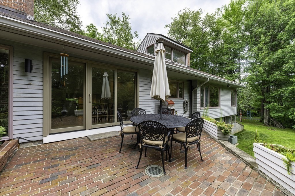 640 Kennedy Road Northampton, MA 01053 - Photo 18 of 42 a view of a house with backyard sitting area and garden