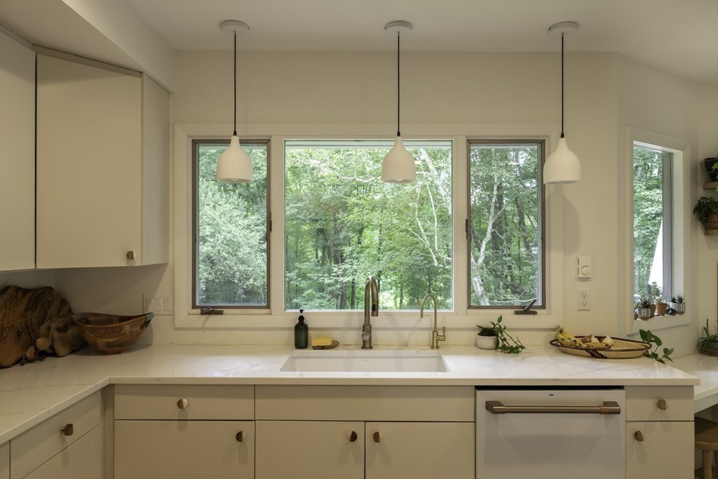 640 Kennedy Road Northampton, MA 01053 - Photo 21 of 42 a kitchen with a sink window and cabinets