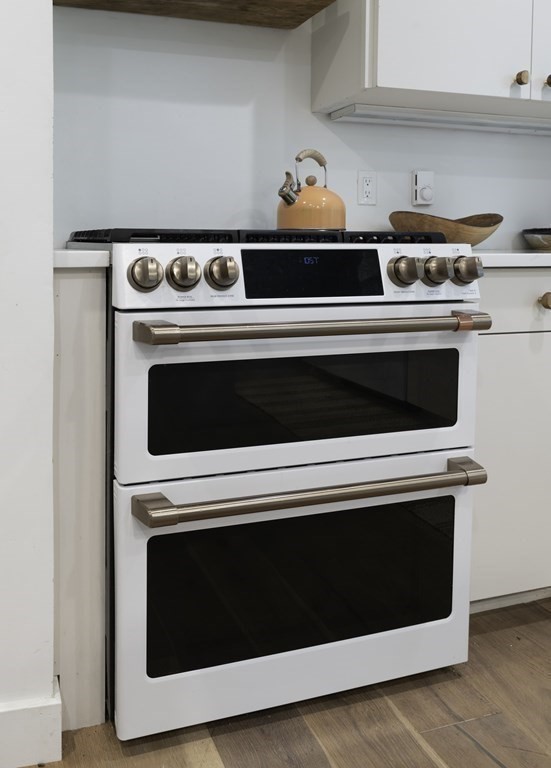 640 Kennedy Road Northampton, MA 01053 - Photo 23 of 42 a stove top oven sitting inside of a kitchen with stainless steel appliances