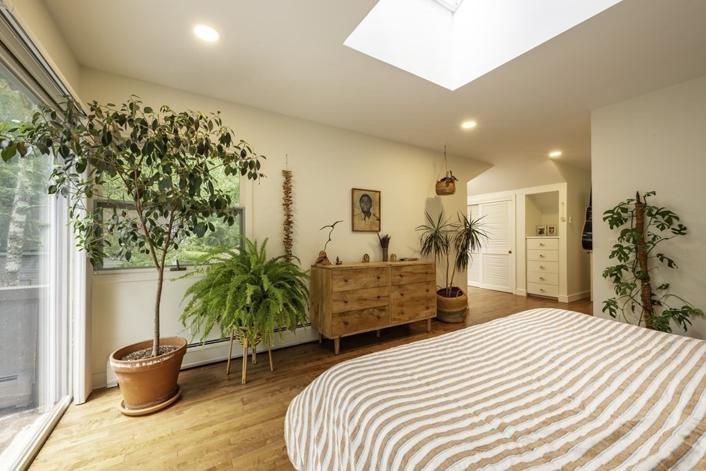 640 Kennedy Road Northampton, MA 01053 - Photo 30 of 42 a bed room with a bed and a potted plant
