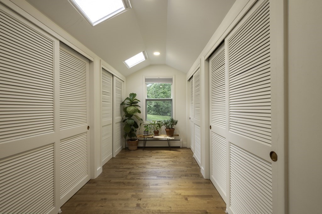 640 Kennedy Road Northampton, MA 01053 - Photo 31 of 42 a view of a hallway with wooden walls and windows