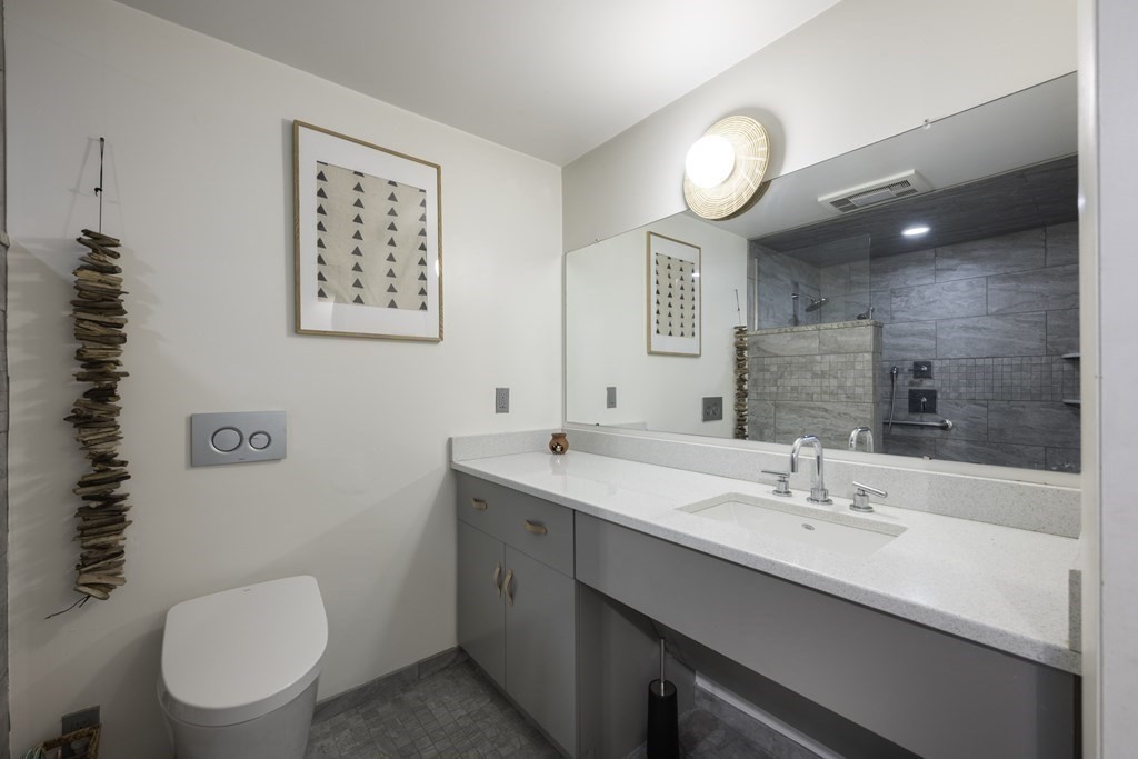 640 Kennedy Road Northampton, MA 01053 - Photo 36 of 42 a bathroom with a toilet a sink and mirror