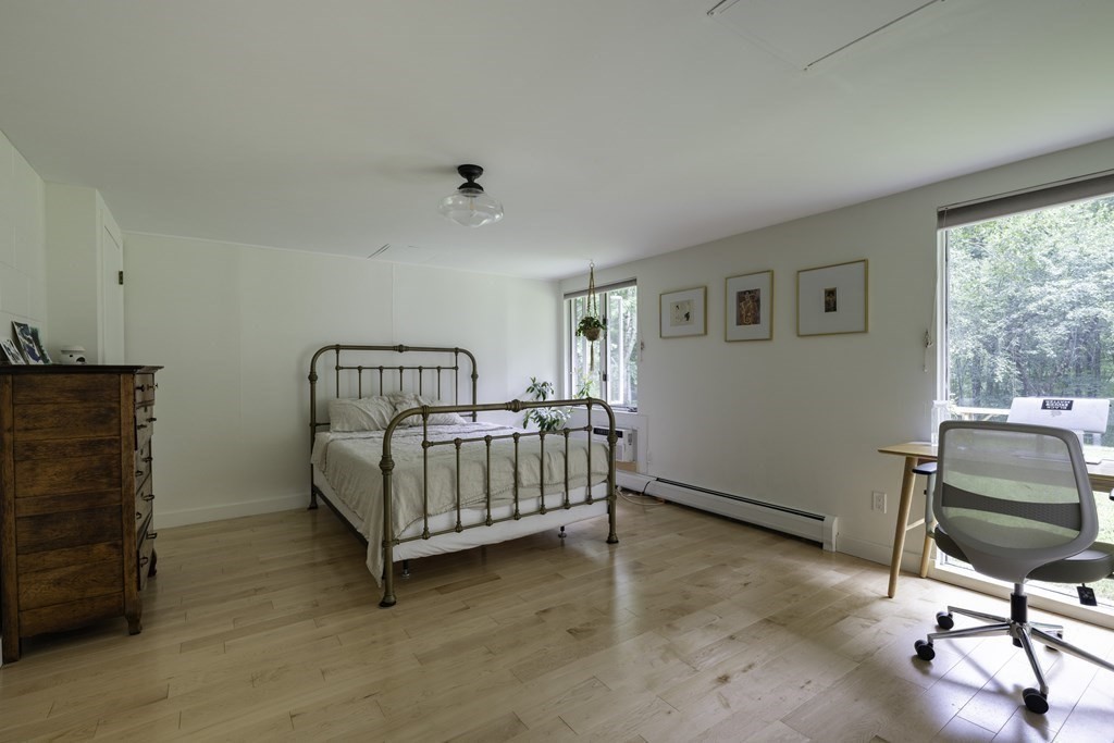 640 Kennedy Road Northampton, MA 01053 - Photo 39 of 42 a bedroom with a bed and chair