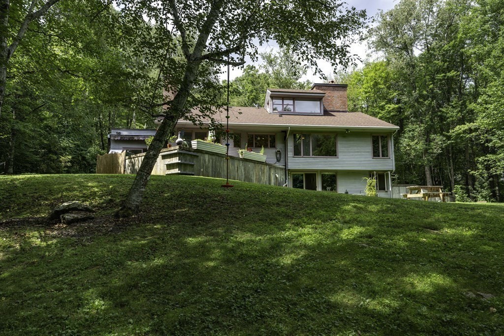 640 Kennedy Road Northampton, MA 01053 - Photo 7 of 42 a front view of a house with a garden