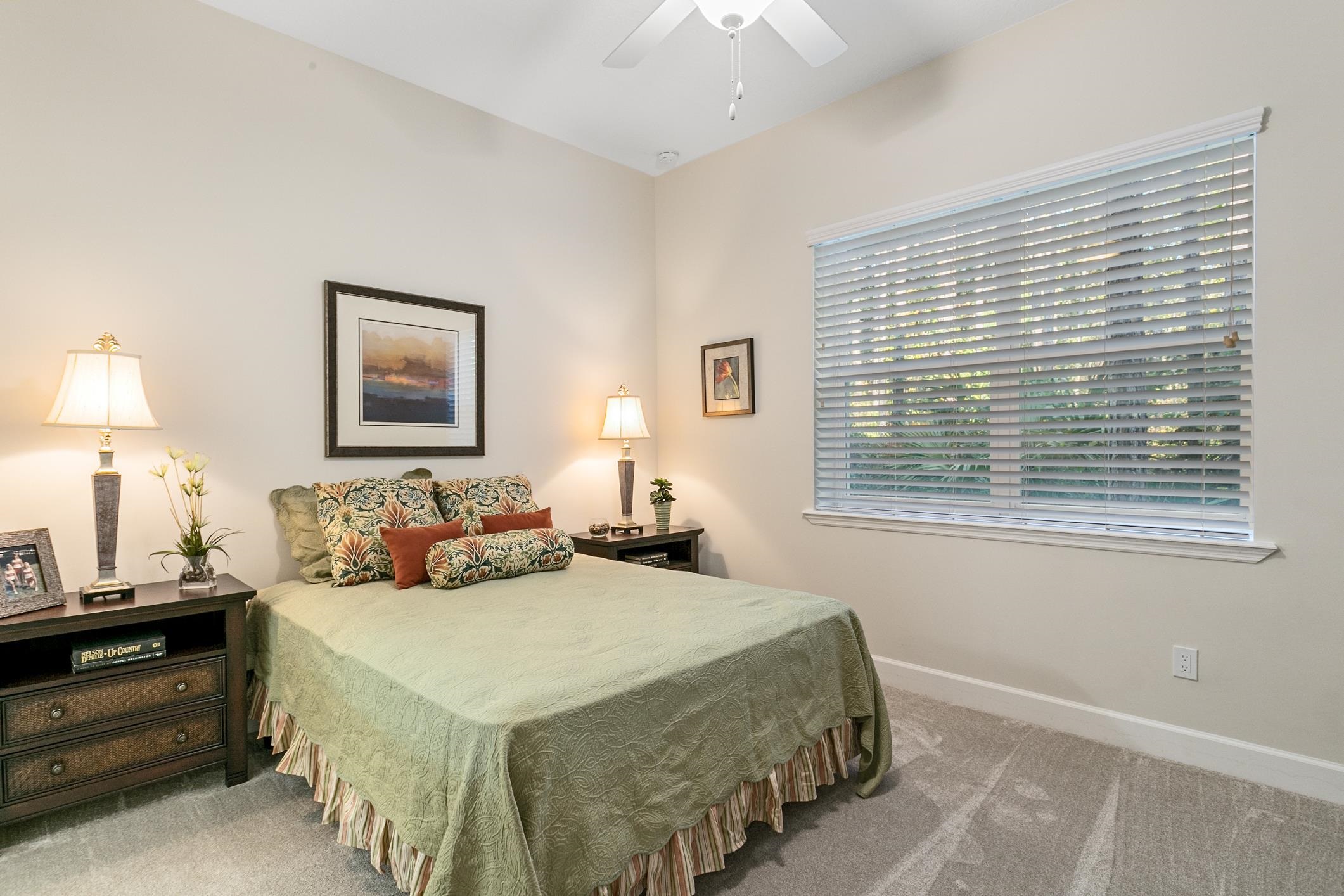 254 Grand Ravine Drive St. Augustine, FL 32086 - Photo 16 of 40 a bedroom with a bed and a window