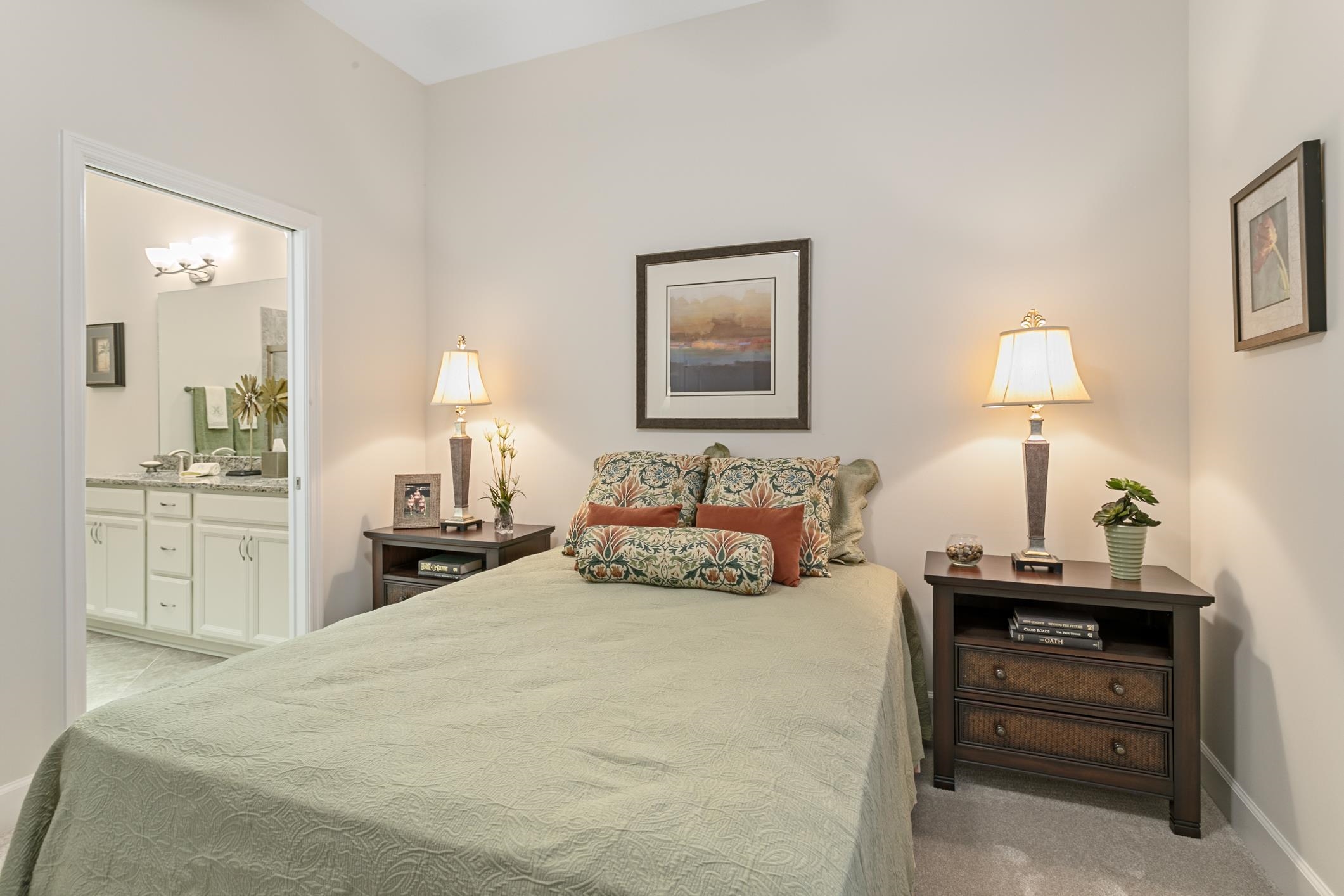 254 Grand Ravine Drive St. Augustine, FL 32086 - Photo 17 of 40 a bedroom with a bed and a lamp on dresser