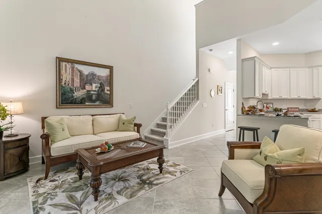 a living room with furniture and a painting