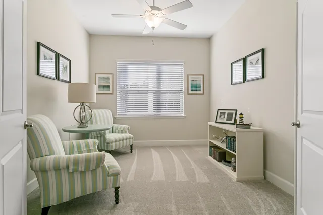 a bedroom with furniture and a window