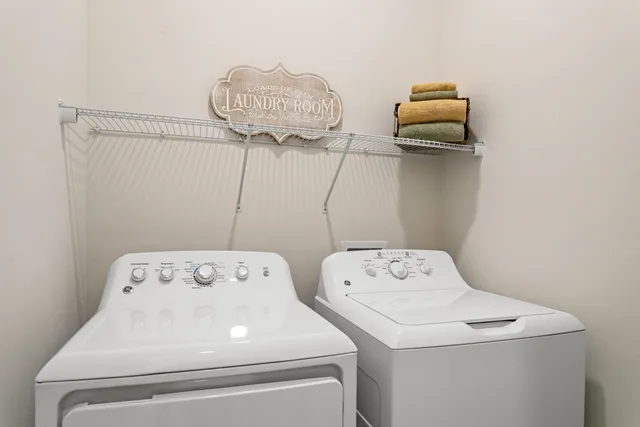 a utility room with dryer and washer