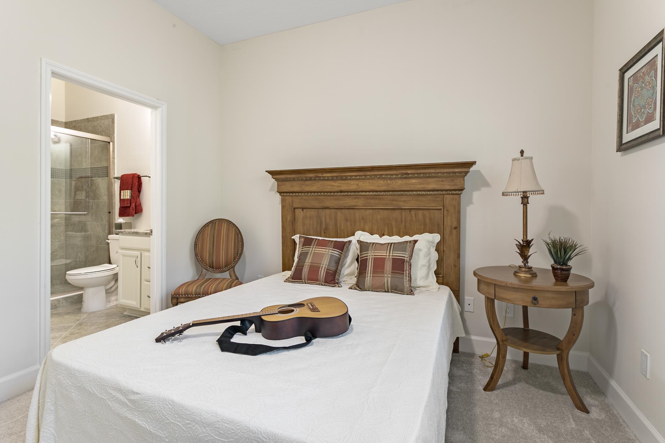 254 Grand Ravine Drive St. Augustine, FL 32086 - Photo 26 of 40 a bedroom with a bed and a table