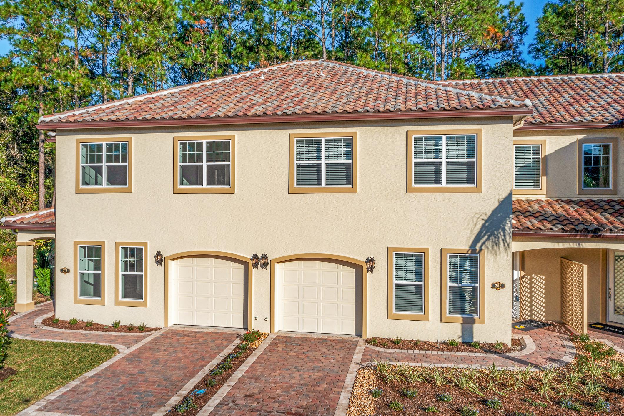 254 Grand Ravine Drive St. Augustine, FL 32086 - Photo 3 of 40 a front view of a house with a yard