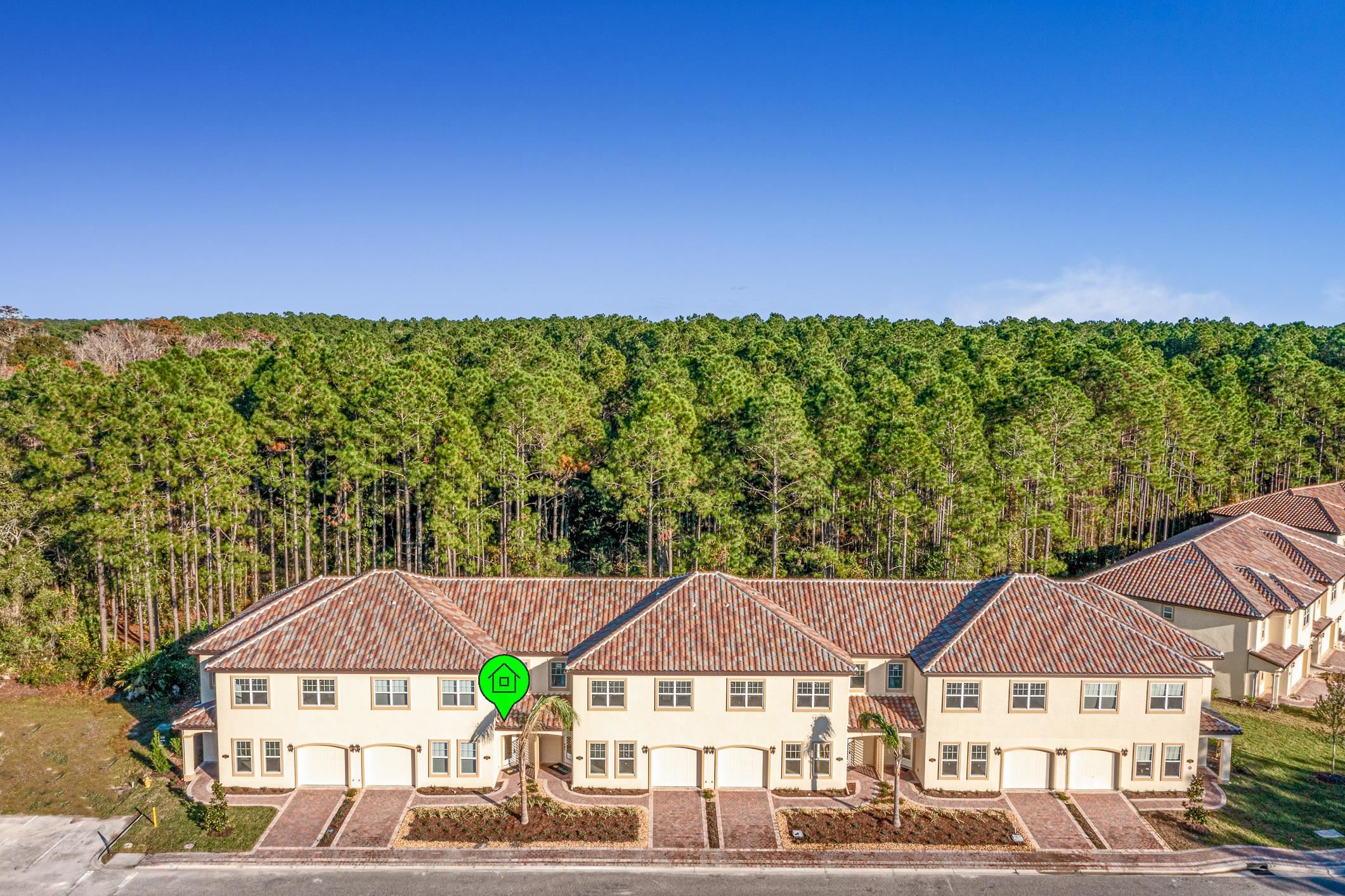 254 Grand Ravine Drive St. Augustine, FL 32086 - Photo 4 of 40 a view of a large building with a yard