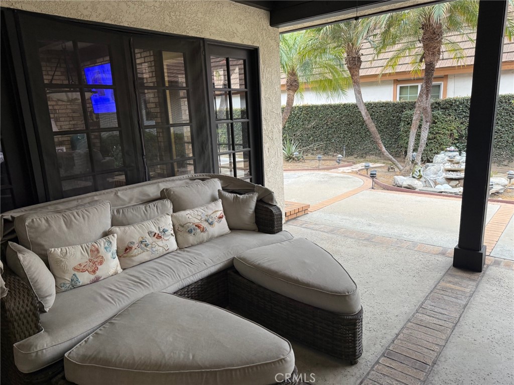 8560 Cherokee Drive Downey, CA 90241 - Photo 26 of 40 a living room with furniture and a floor to ceiling window