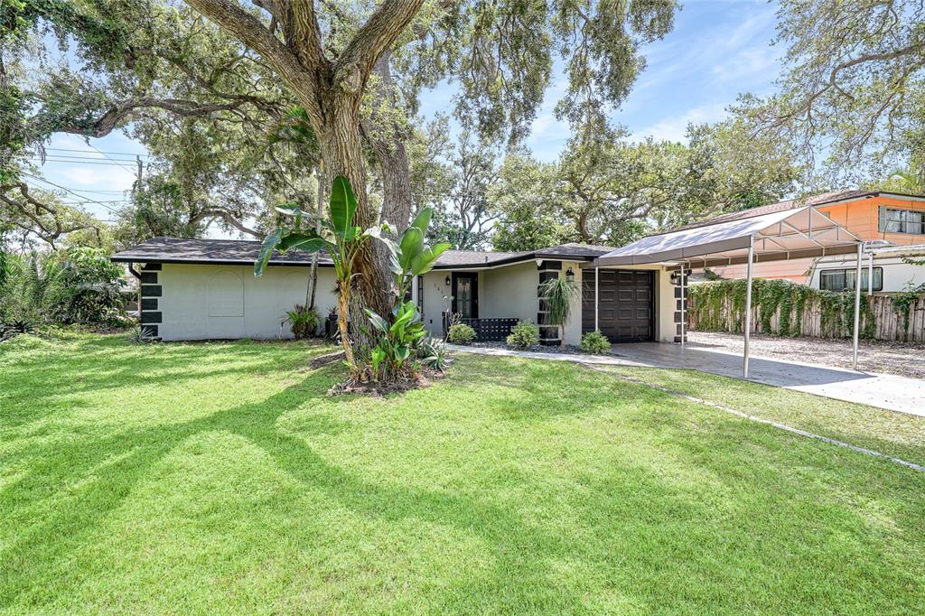 185 Zephyr Road Venice, FL 34293 - Photo 1 of 1 a view of a house with a yard and large tree
