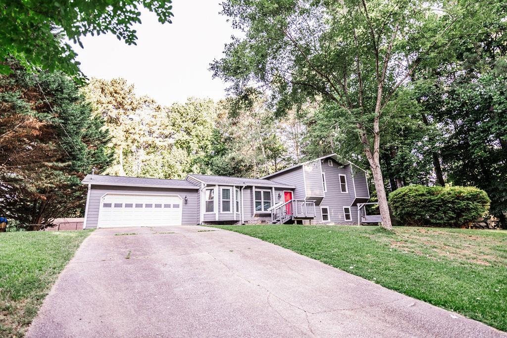 377 Mill Ridge Way Lawrenceville, GA 30046 - Photo 1 of 1 a view of an house with backyard and trees