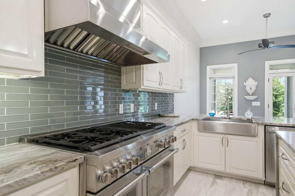 774 Bray Road Southwest Calhoun, GA 30701 - Photo 23 of 106 a kitchen with granite countertop stainless steel appliances and white cabinets