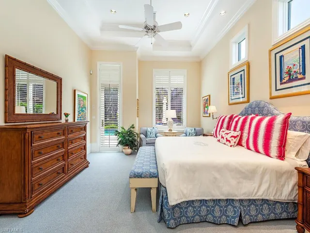 a living room with a bed and furniture