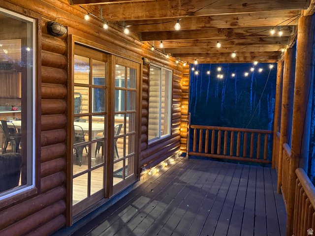 15253 Mill Road, Unit 62 Huntsville, UT 84317 - Photo 47 of 48 Wood-finish deck with log siding and exposed beam ceiling