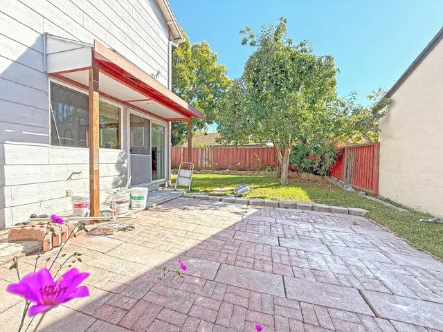 a view of a lounge chair in the front of house