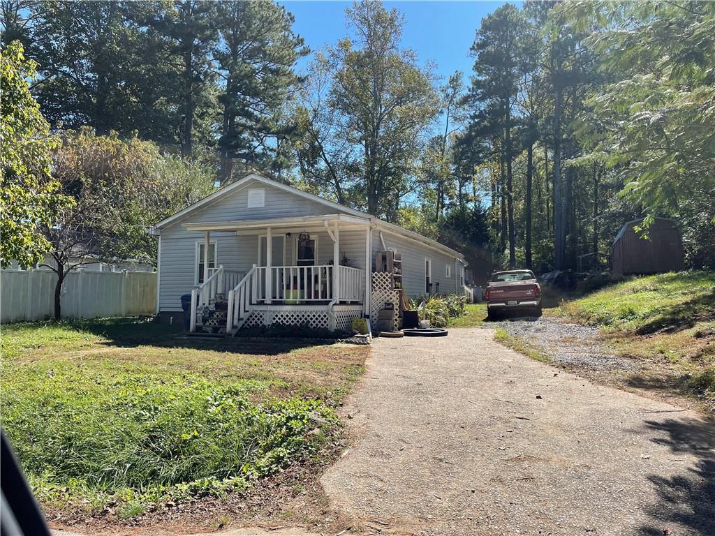 349 Old Acworth Road Dallas, GA 30132 - Photo 1 of 1 a view of a house with a yard covered in snow