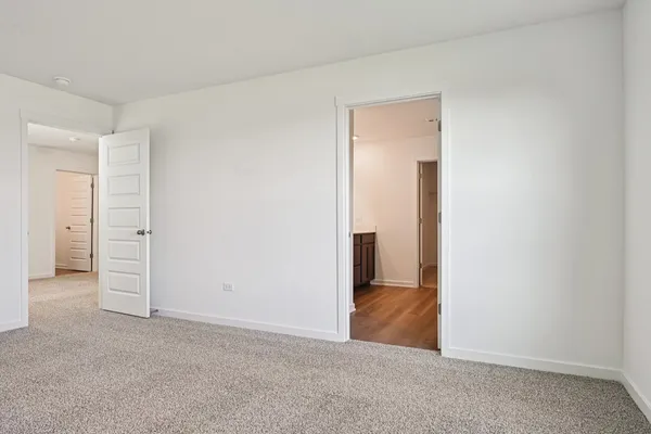 an empty room with closet area