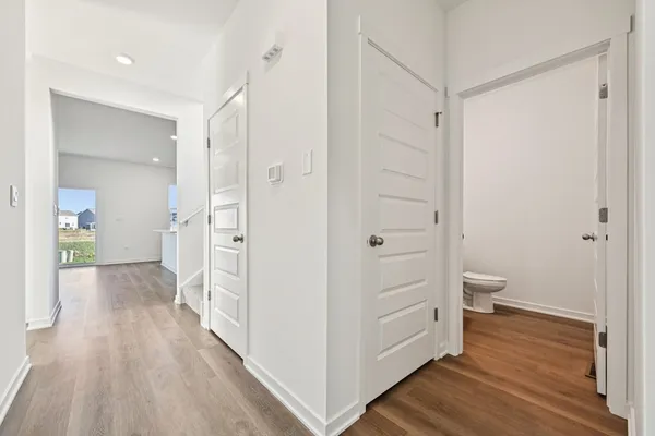 a view of a bathroom from a hallway
