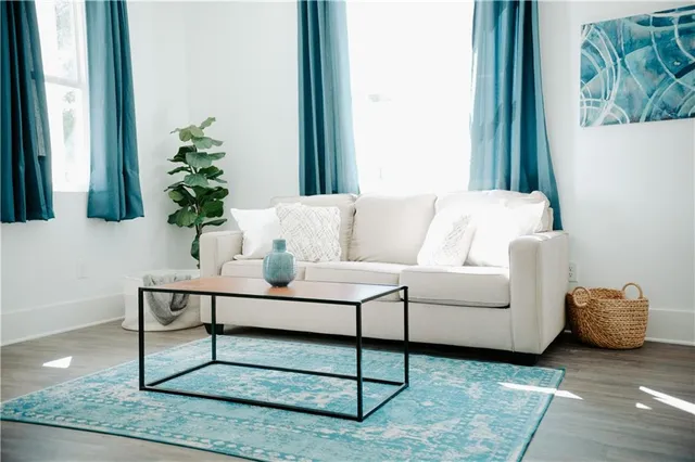 a bathroom with a double vanity sink a mirror and a bathtub