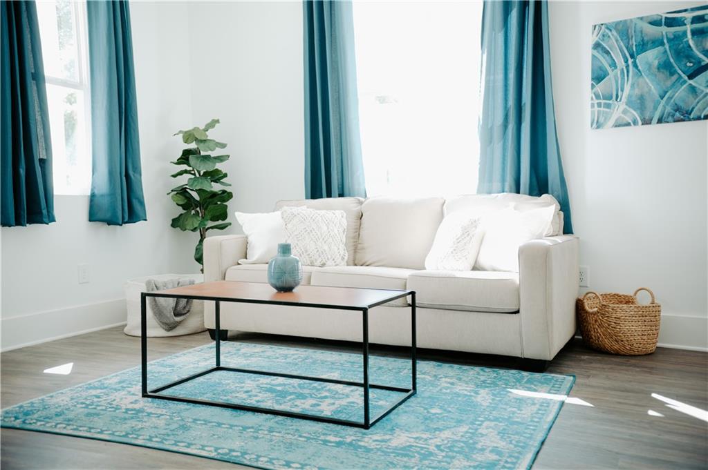 123 Mayson Avenue Northeast, Unit C Atlanta, GA 30307 - Photo 13 of 21 a living room with furniture and a potted plant