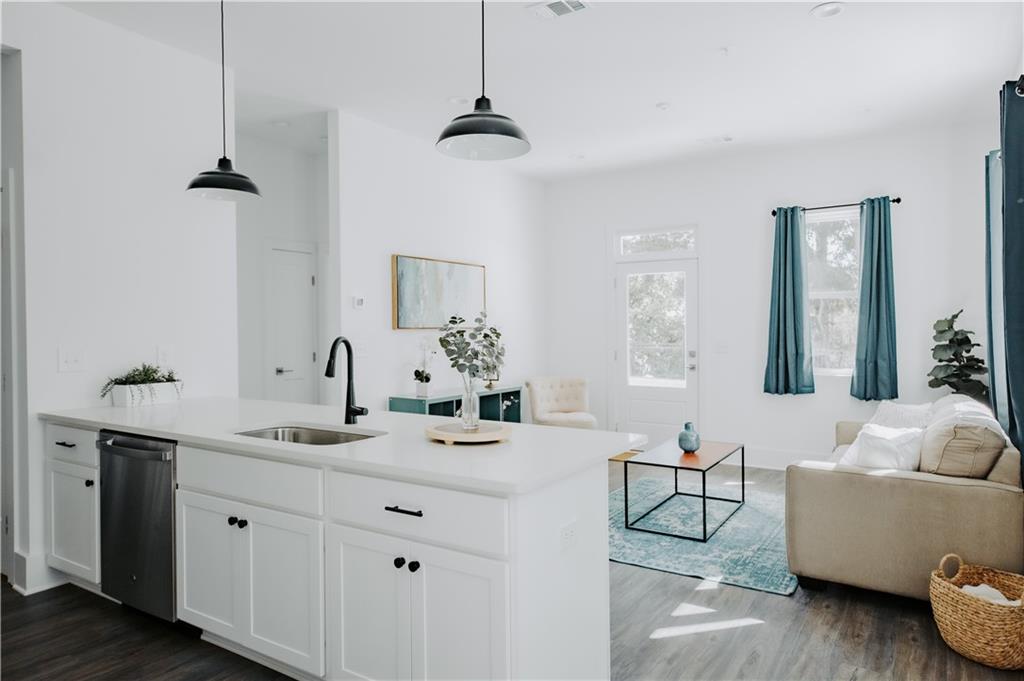 123 Mayson Avenue Northeast, Unit C Atlanta, GA 30307 - Photo 14 of 21 a bathroom with a double vanity sink a mirror and a bathtub