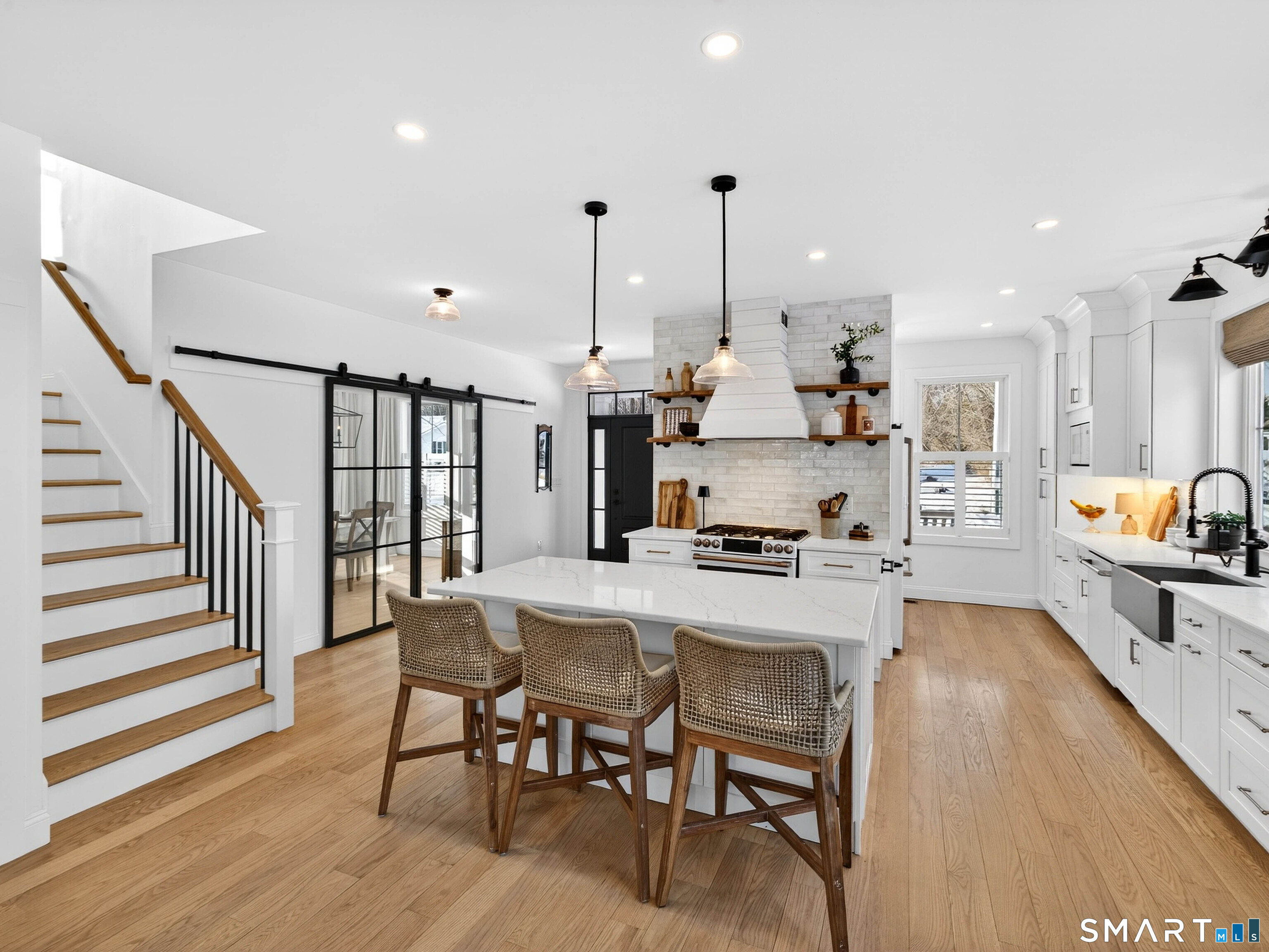 24 Church Street Old Saybrook, CT 06475 - Photo 1 of 1 a large kitchen with a table and chairs