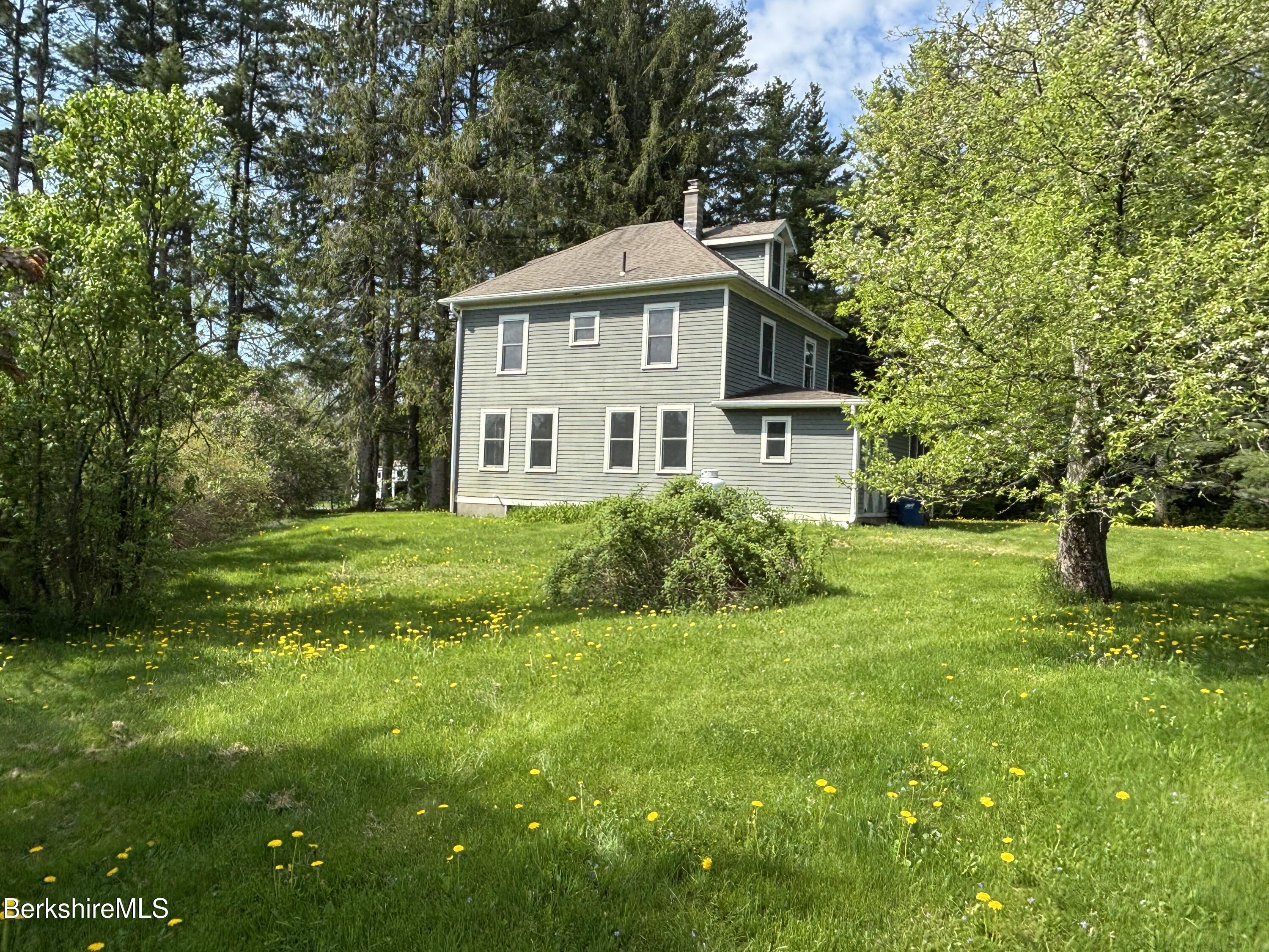 86 Miner Road Lanesborough, MA 01237 - Photo 3 of 44 a front view of a house with a yard