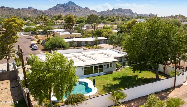 an aerial view of a town with swimming pool