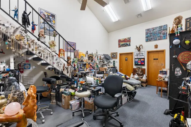 a living room with lots of furniture and a chandelier