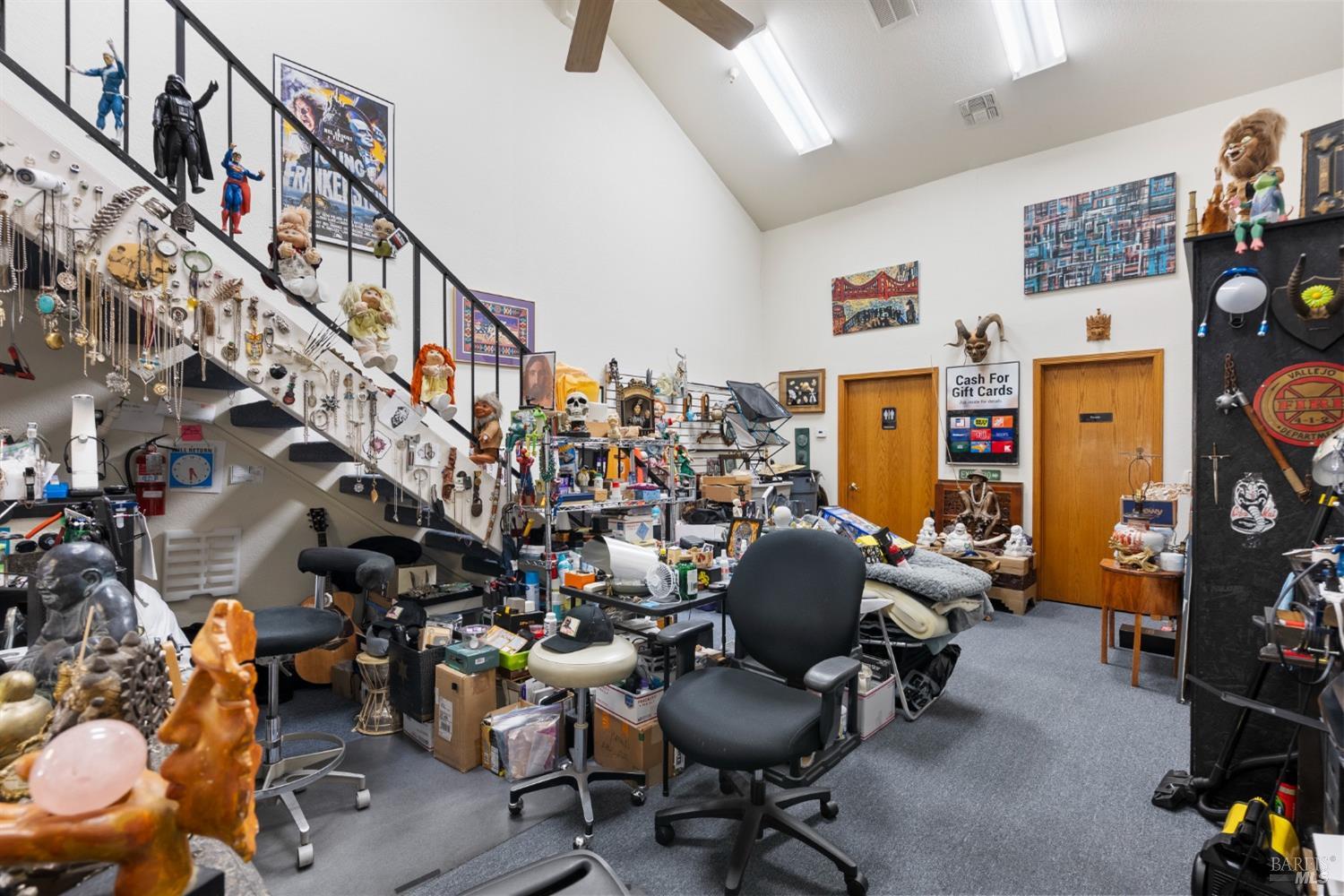 6650 Commerce Boulevard, Unit 16 Rohnert Park, CA 94928 - Photo 5 of 15 a living room with lots of furniture and a chandelier