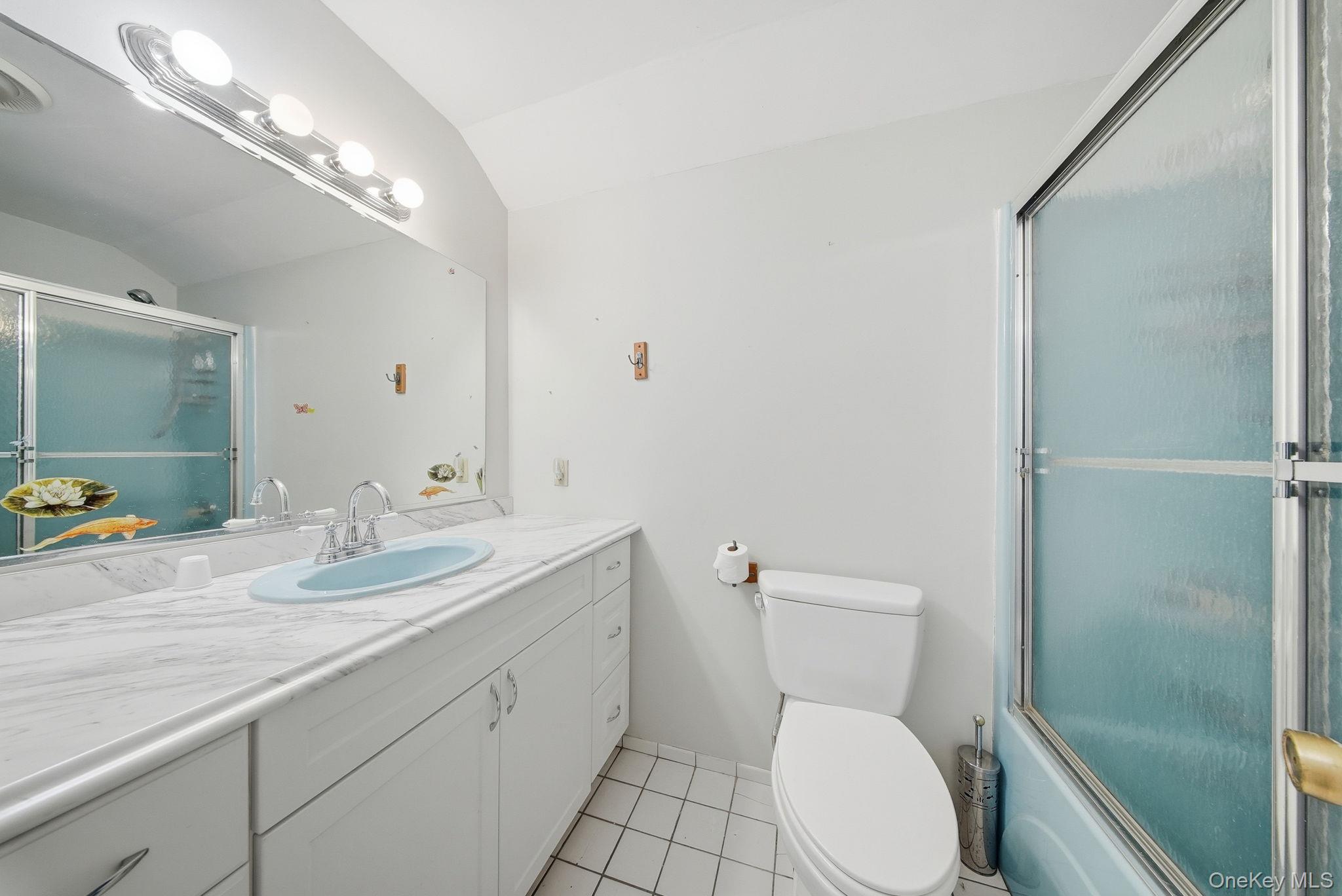 139 Renner Road Mountain Dale, NY 12763 - Photo 25 of 50 a bathroom with a toilet a sink and mirror