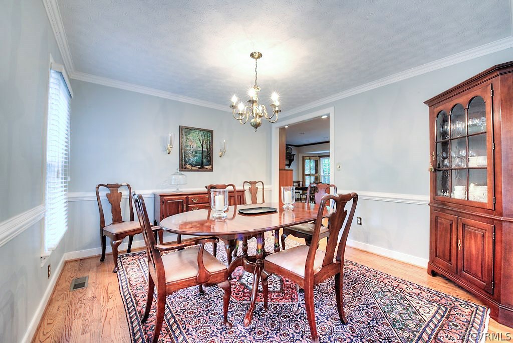 12808 Rivers Bend Road Chester, VA 23836 - Photo 12 of 41 a view of a dining room with furniture and window