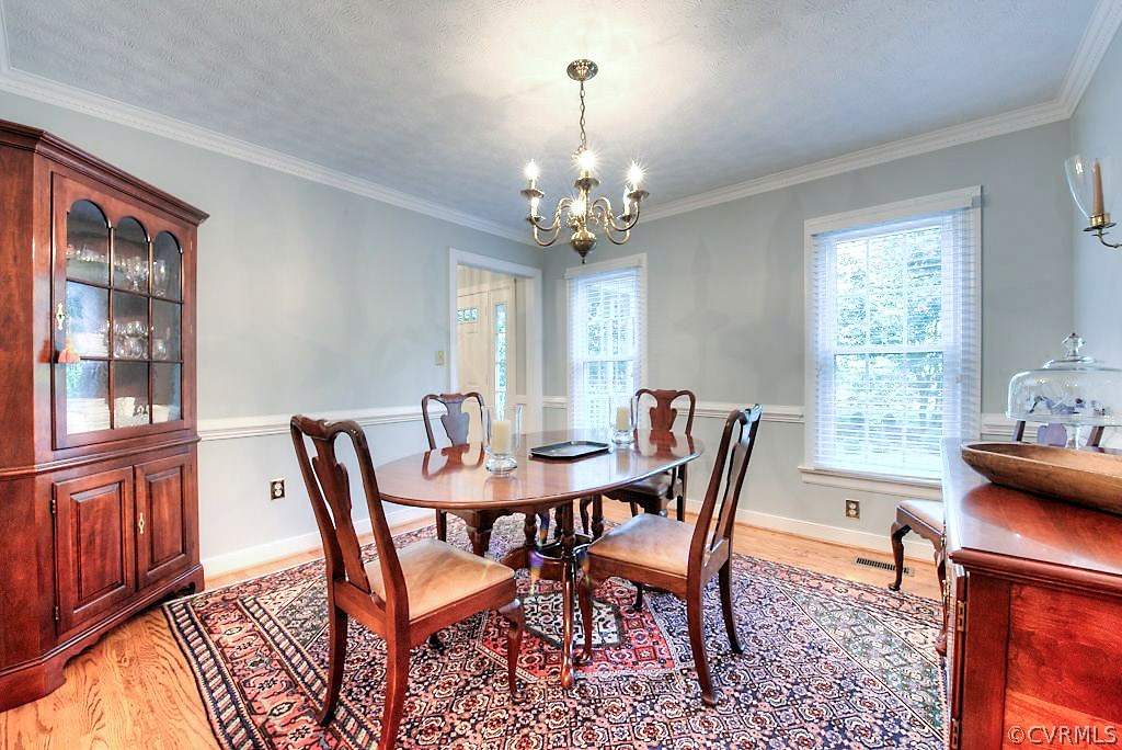 12808 Rivers Bend Road Chester, VA 23836 - Photo 13 of 41 a view of a dining room with furniture window and outside view