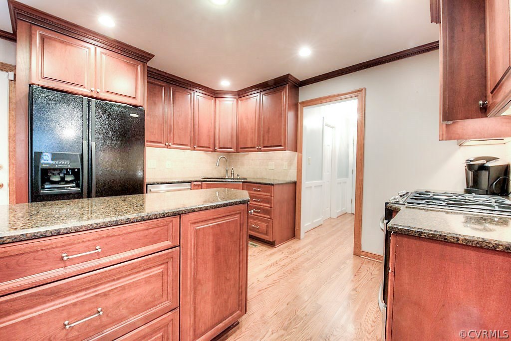 12808 Rivers Bend Road Chester, VA 23836 - Photo 19 of 41 a kitchen with stainless steel appliances granite countertop a refrigerator and a sink
