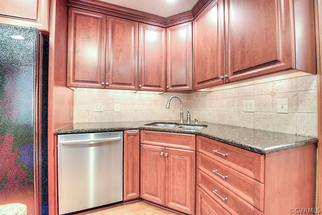 12808 Rivers Bend Road Chester, VA 23836 - Photo 20 of 41 a kitchen with granite countertop cabinets stainless steel appliances and a window