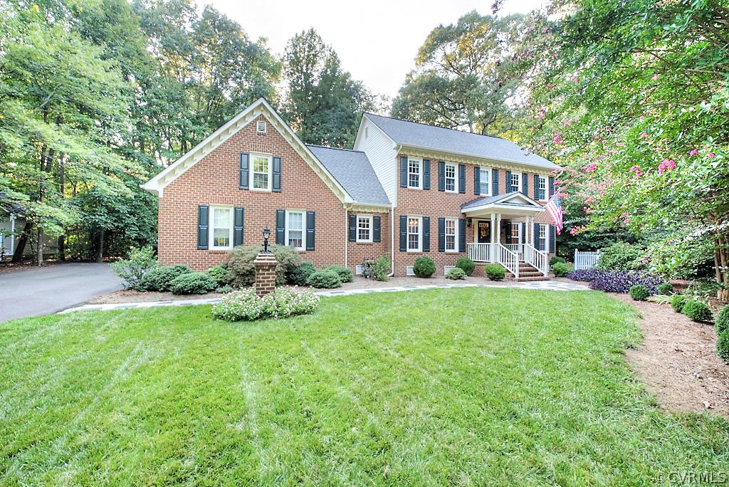 12808 Rivers Bend Road Chester, VA 23836 - Photo 2 of 41 a front view of a house with yard and green space