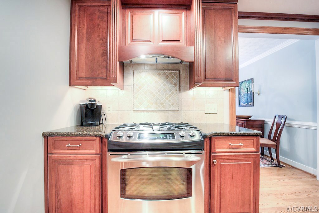 12808 Rivers Bend Road Chester, VA 23836 - Photo 21 of 41 a stove top oven sitting inside of a kitchen