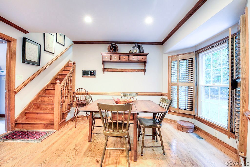 12808 Rivers Bend Road Chester, VA 23836 - Photo 23 of 41 a dining room with furniture and wooden floor