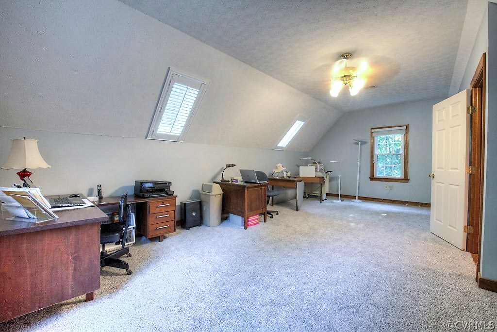 12808 Rivers Bend Road Chester, VA 23836 - Photo 29 of 41 a view of a workspace with furniture and a window