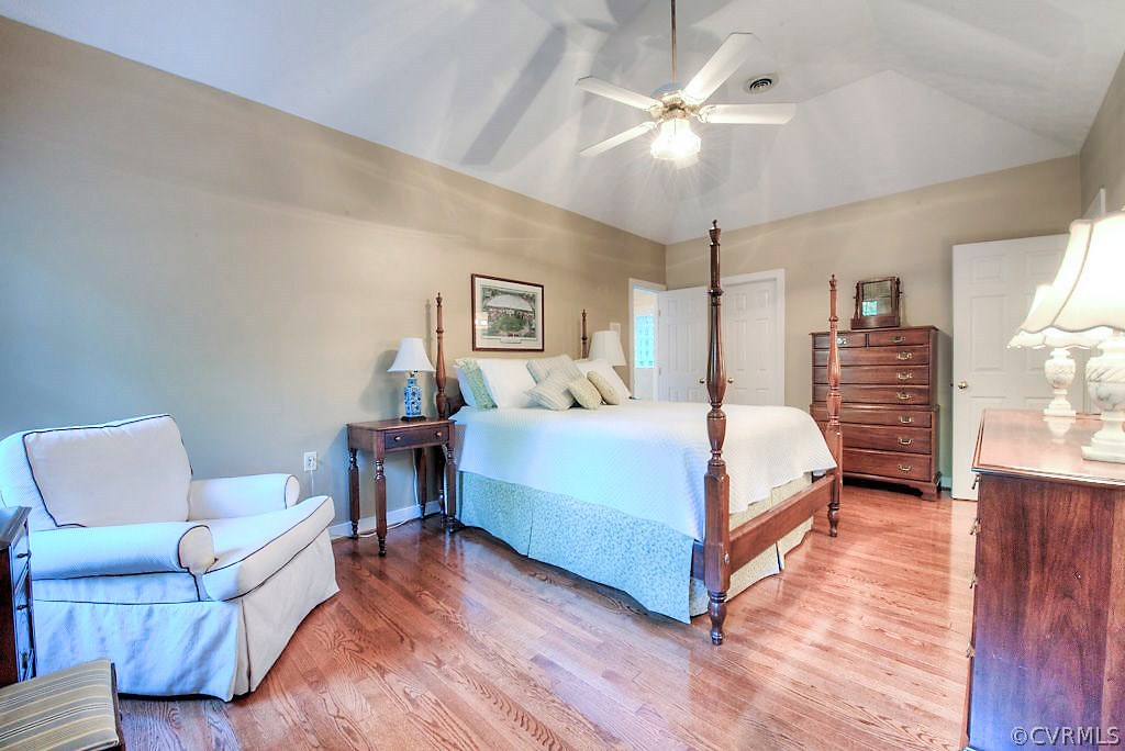 12808 Rivers Bend Road Chester, VA 23836 - Photo 31 of 41 a bedroom with a bed couch chandelier and a window
