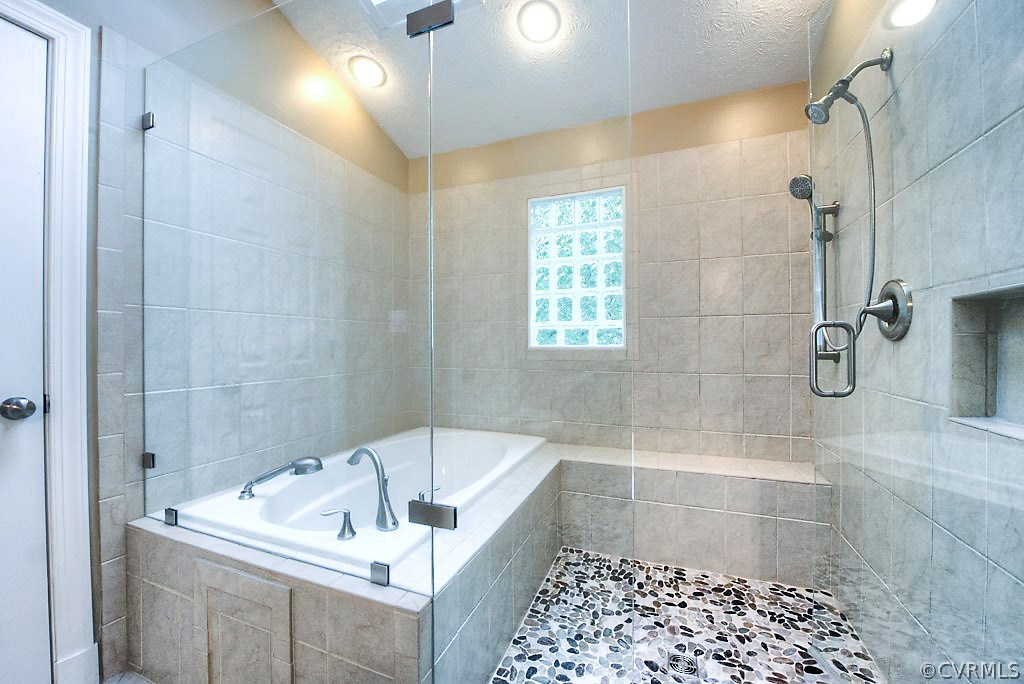 12808 Rivers Bend Road Chester, VA 23836 - Photo 33 of 41 a bath tub sitting in a bathroom and shower