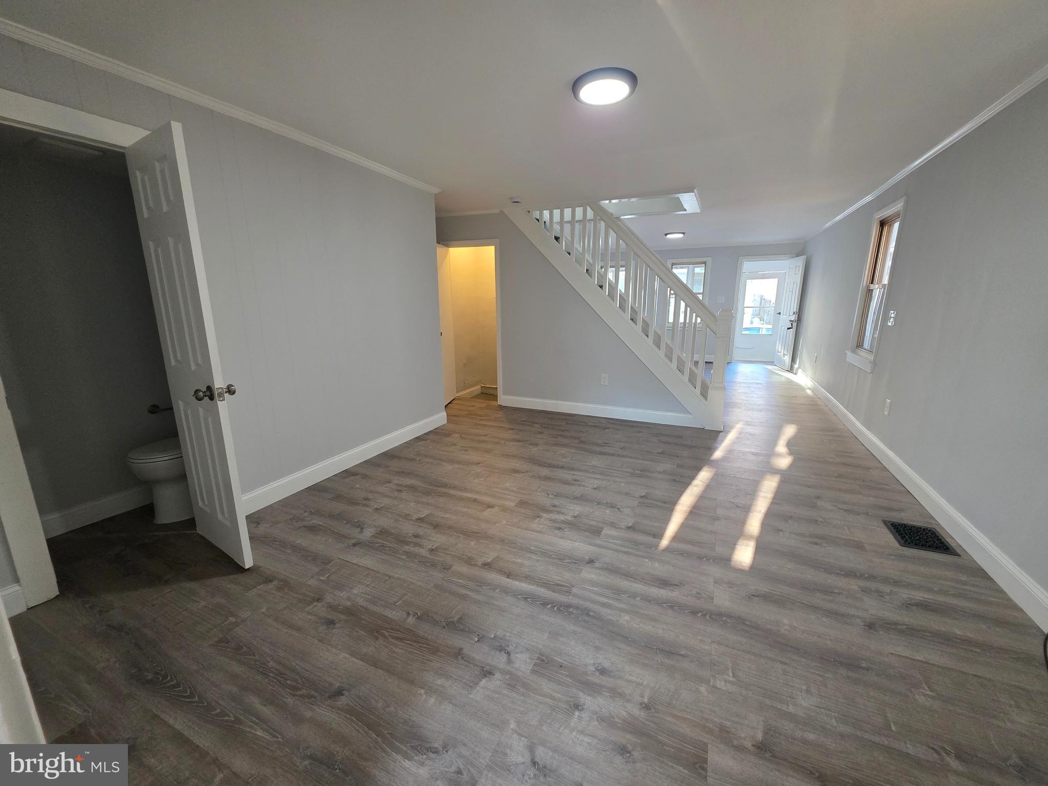 340 Middlesex Street Gloucester City, NJ 08030 - Photo 6 of 17 a view of entryway and hall with wooden floor