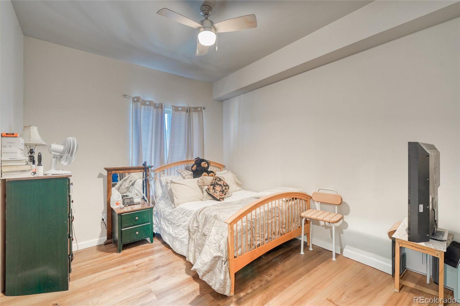 209 Summitview Lane Poncha Springs, CO 81201 - Photo 15 of 44 a bedroom with a bed wooden floor and a chandelier