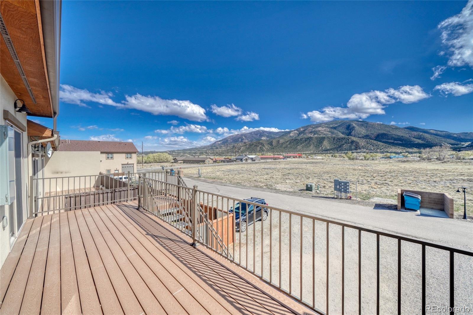 209 Summitview Lane Poncha Springs, CO 81201 - Photo 19 of 44 a view of a balcony with wooden floor and fence